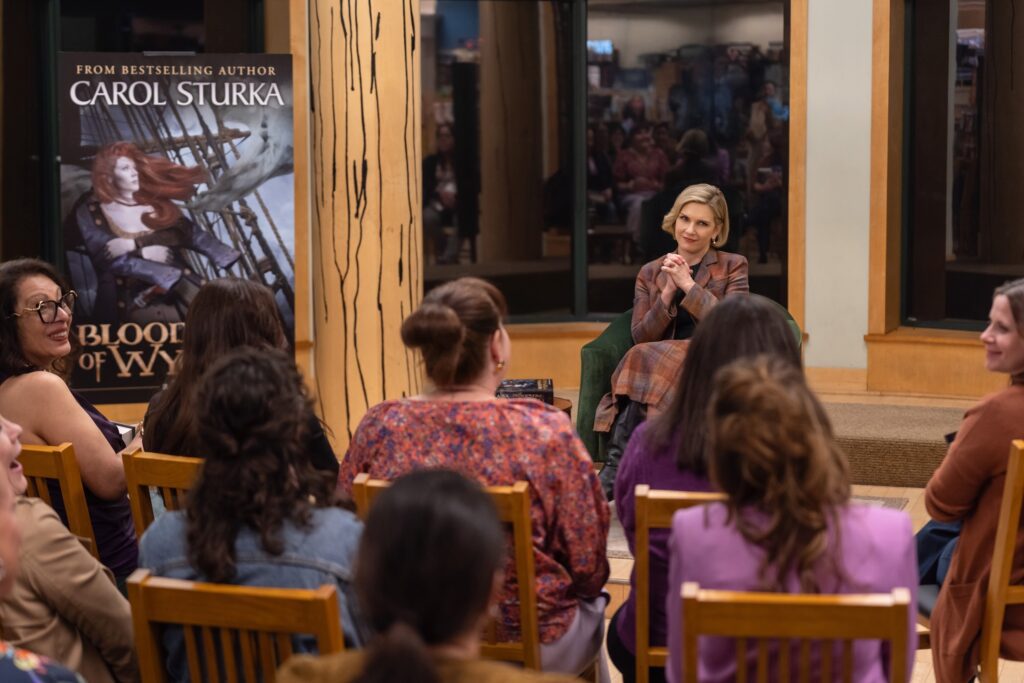 Carol Sturka (played by Rhea Seehorn) at her book tour in a Barnes & Noble