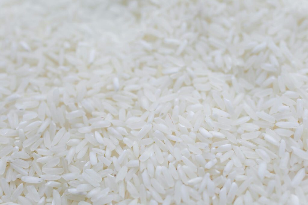A closeup view of uncooked white rice grains.