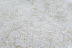 A closeup view of uncooked white rice grains.