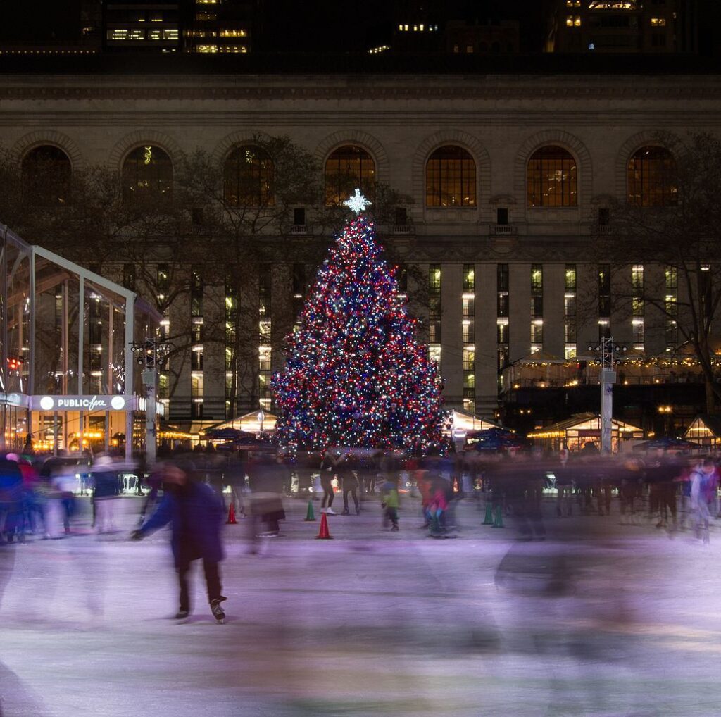 People ice skating on The Pond, a rink in Manhattan's Bryant Park