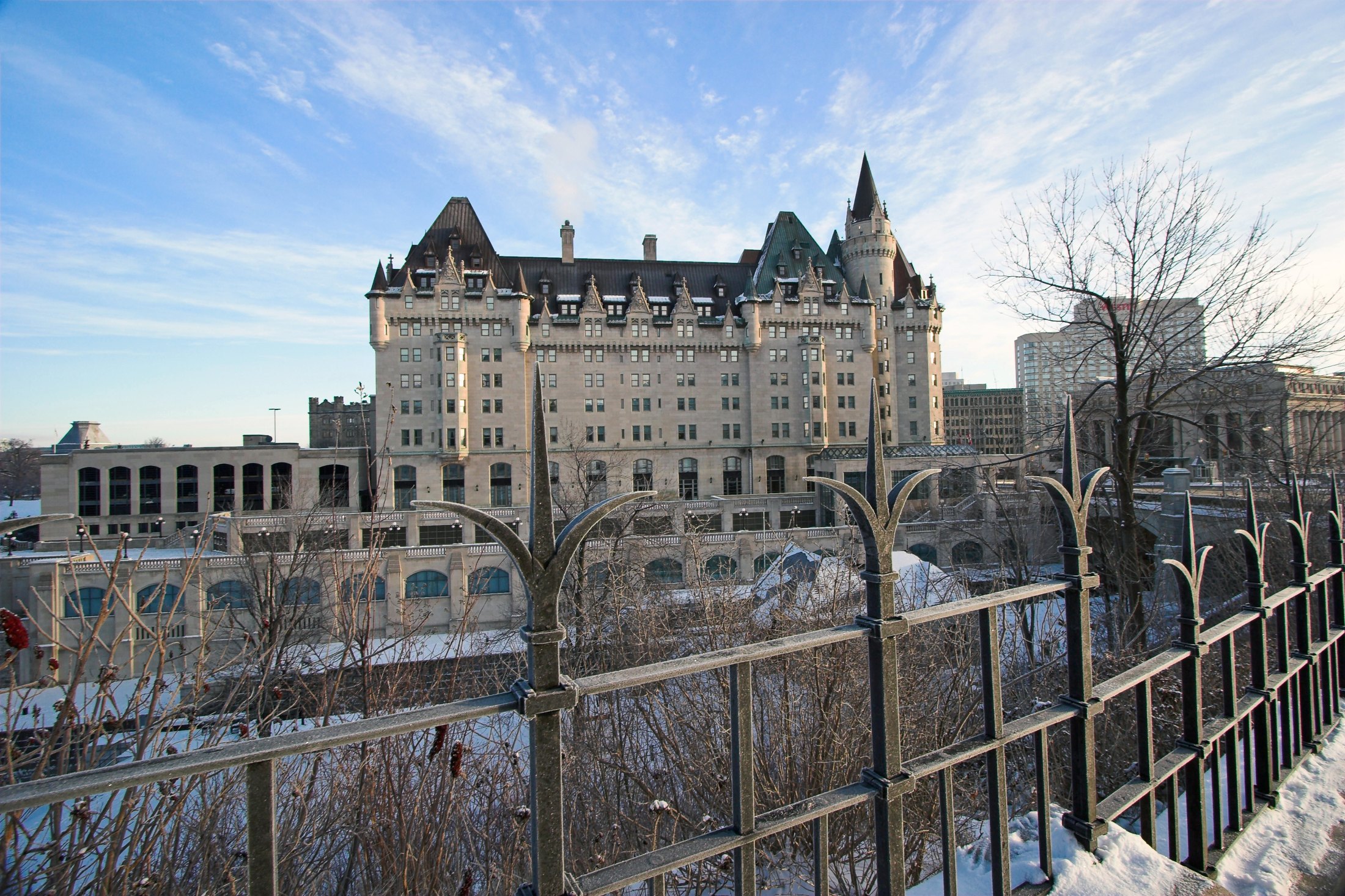 Château Laurier’s limestone facade and steep roofs above the Rideau Canal in Ottawa