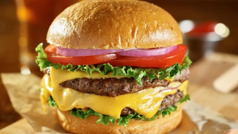 Double cheeseburger on a wooden board