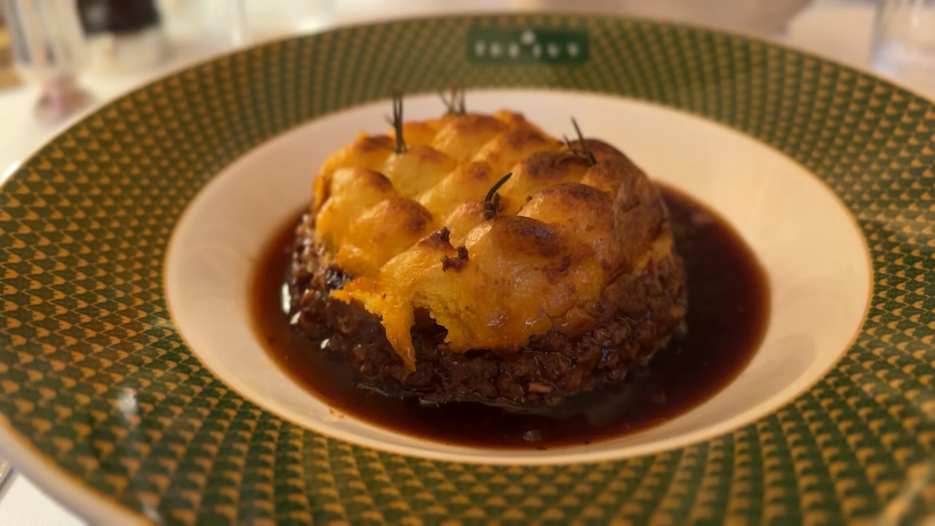 Shepherd's pie with browned potato topping and gravy at The Ivy.