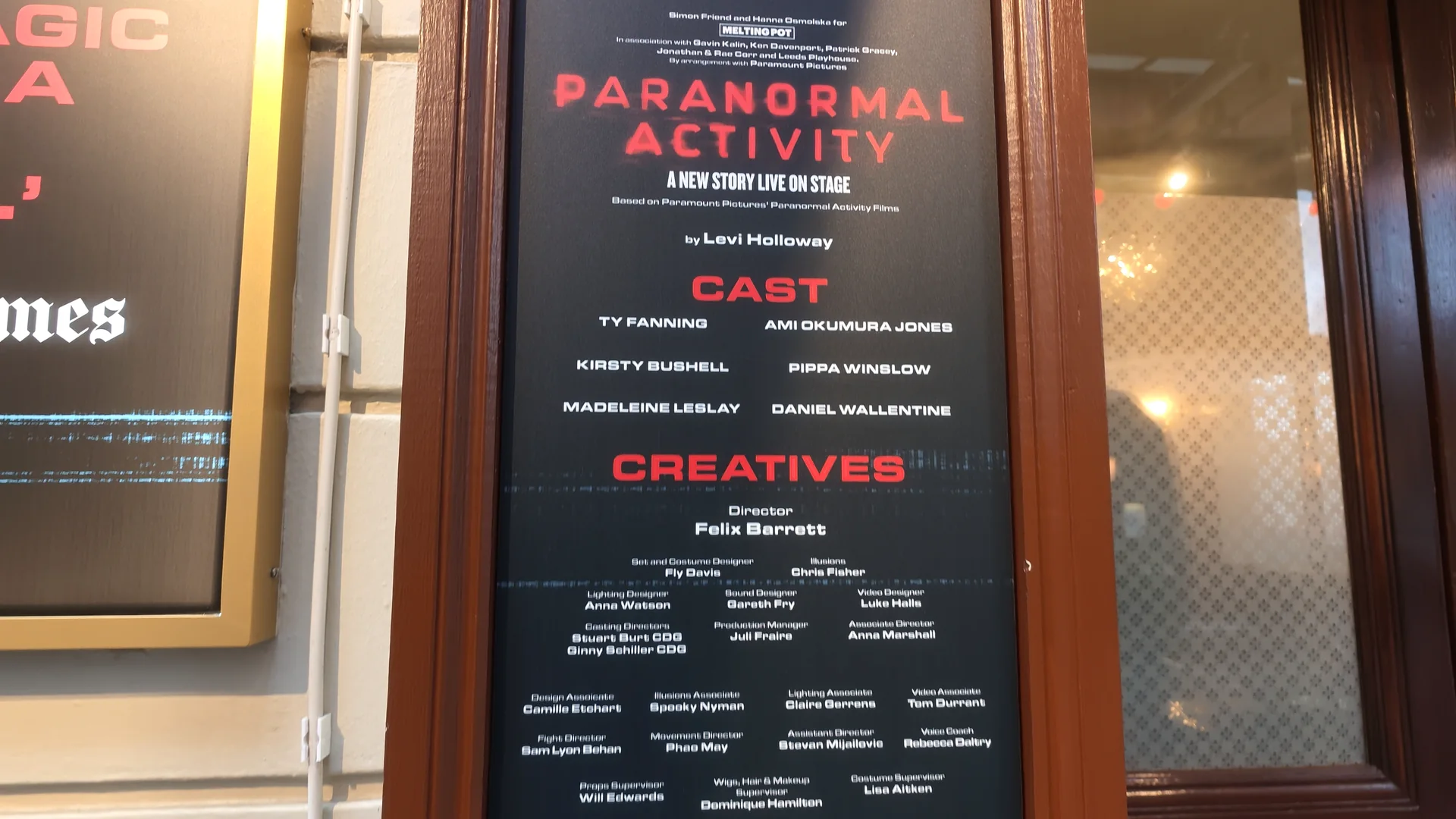 The Paranormal Activity cast and creative-team display at the theater.