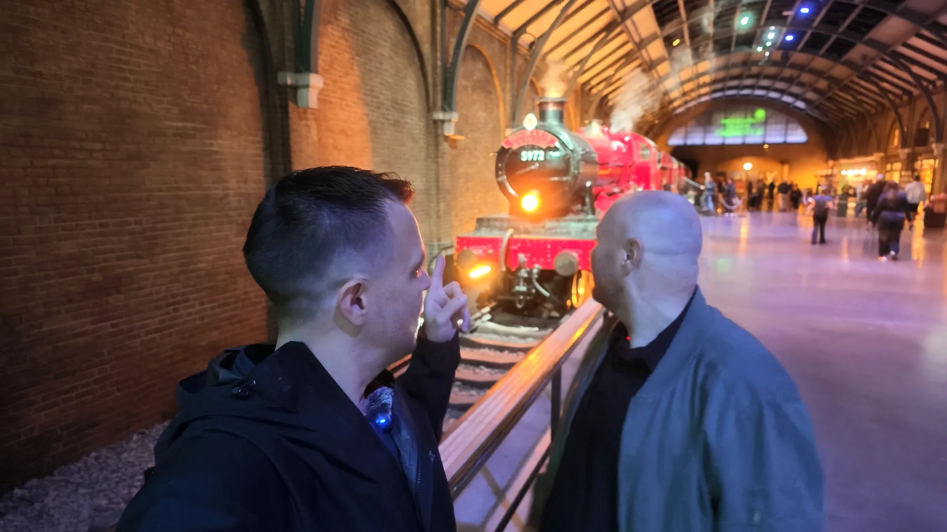 Beau and Sean looking at the Hogwarts Express inside the Studio Tour.