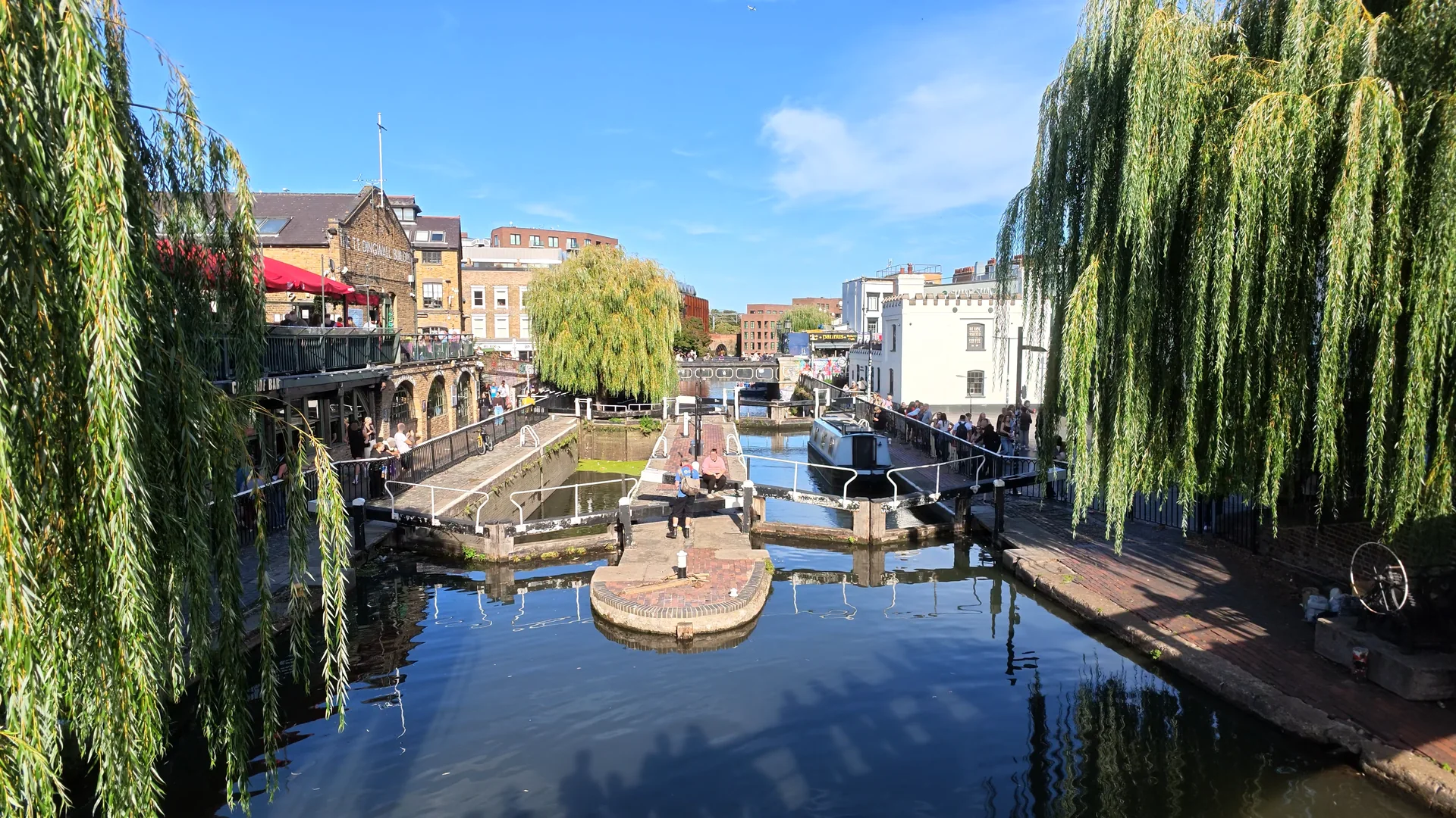 Canal boats and lock gates beside Camden Market.