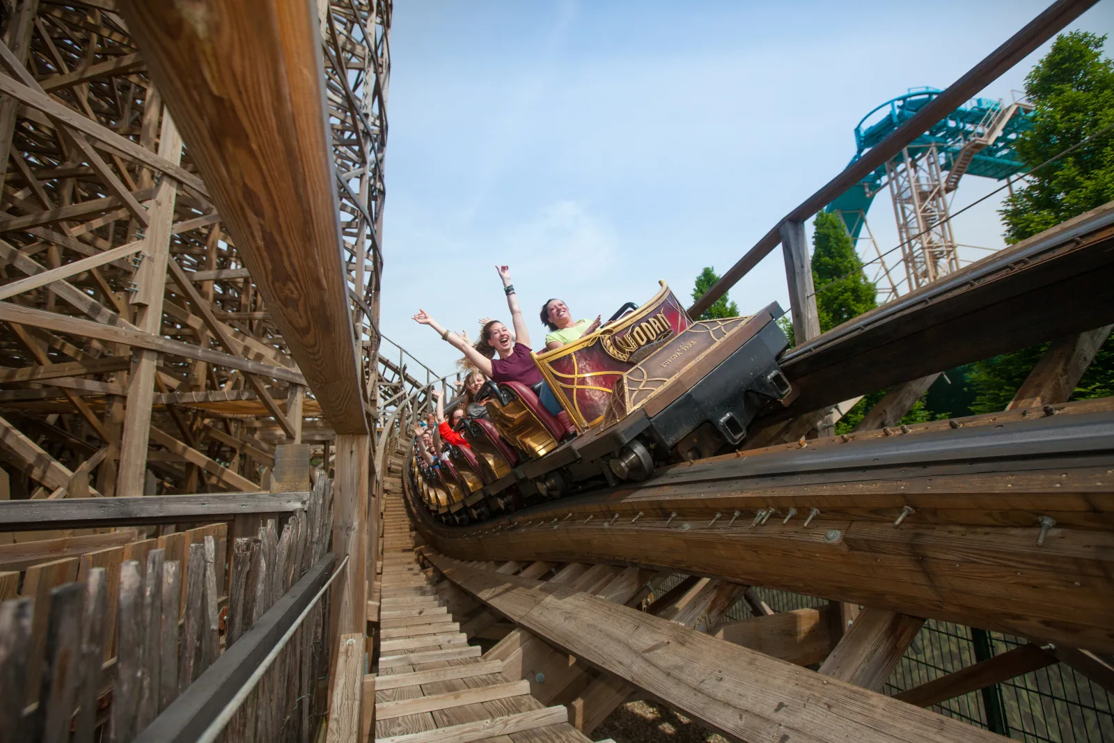 A WODAN train descending through its wooden track structure.