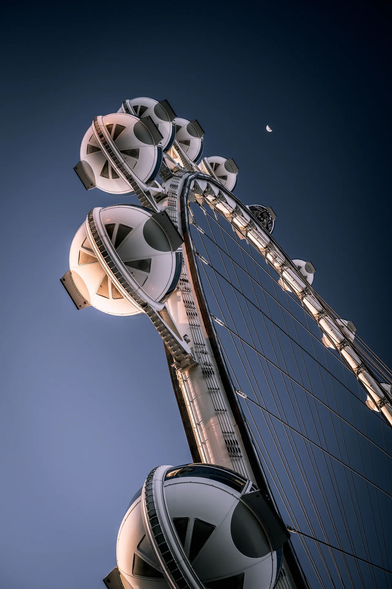 Enclosed cabins on the High Roller observation wheel against the night sky