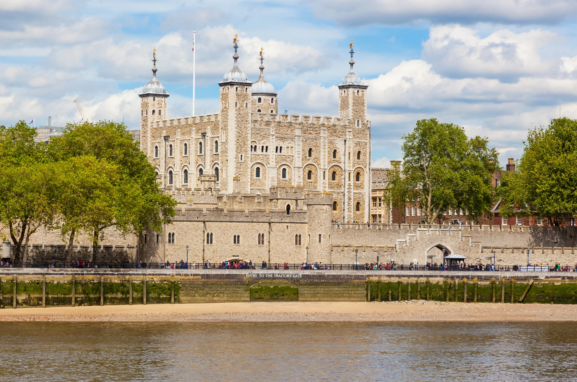 The White Tower rises above the fortress walls beside the Thames