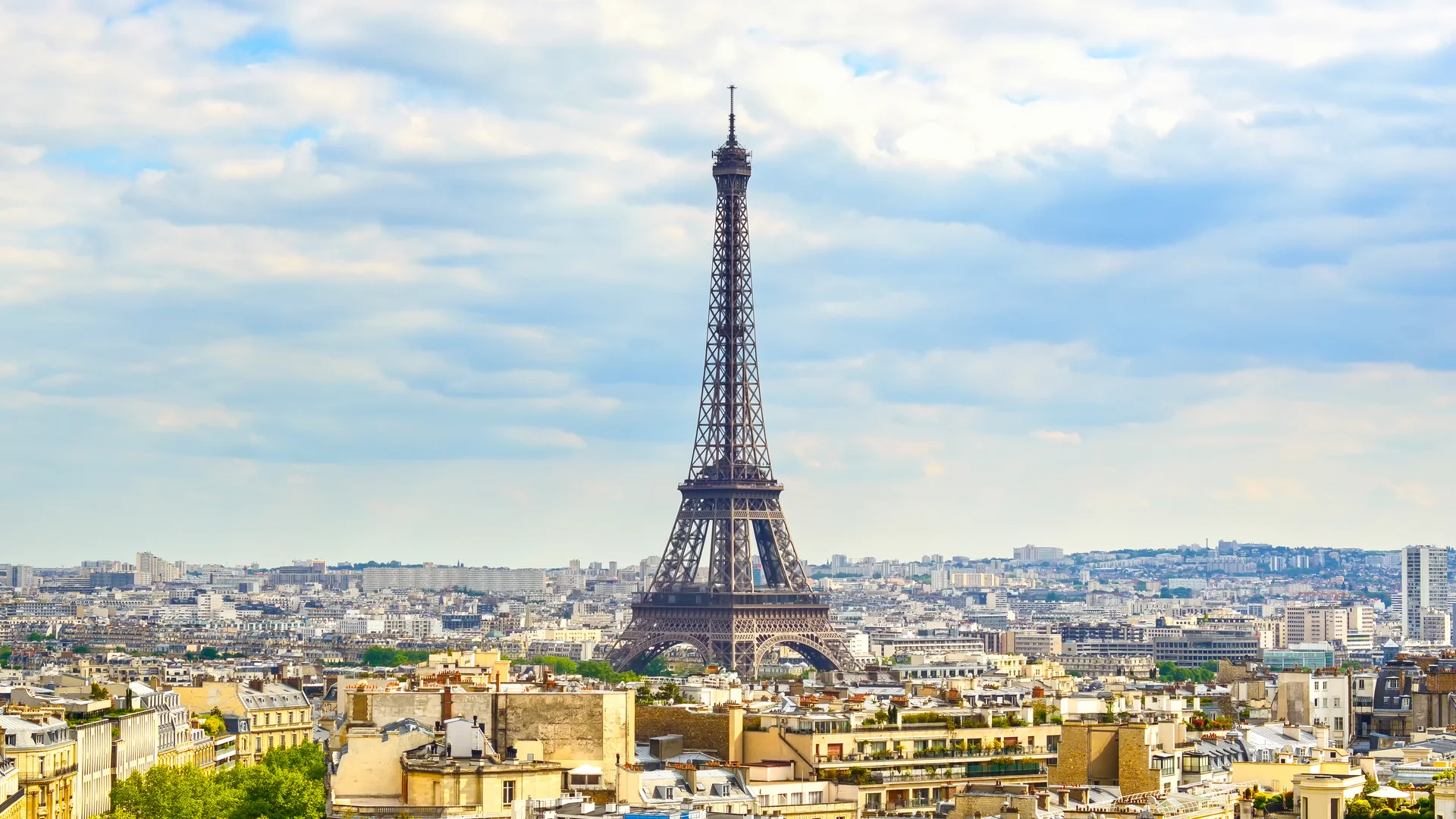 The Eiffel Tower above the Paris skyline in daylight