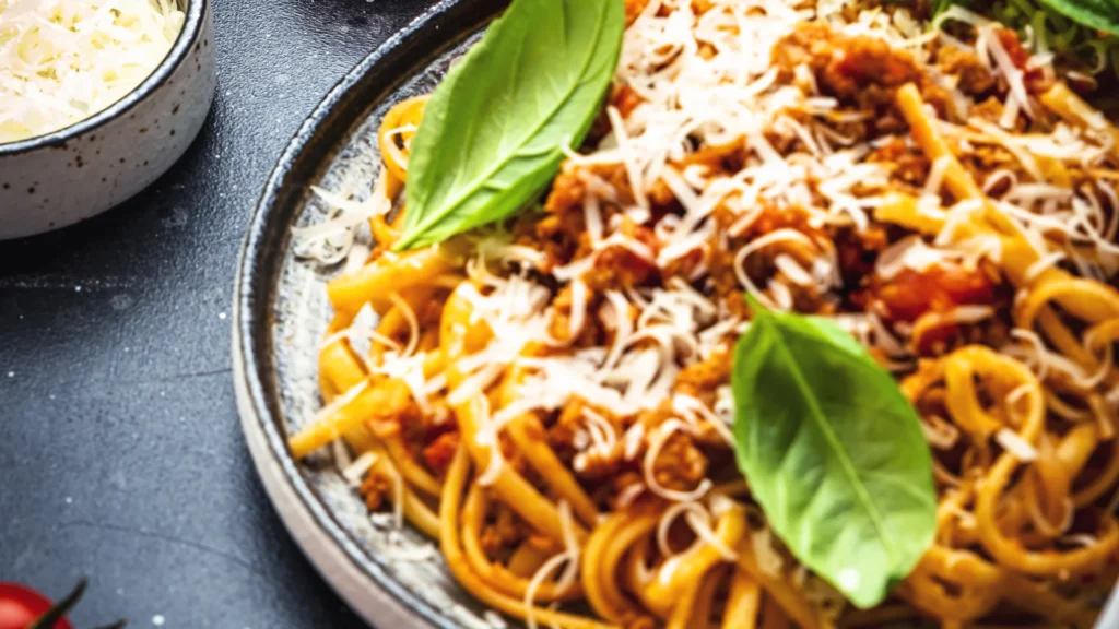 Pasta with meat sauce on a dinner plate